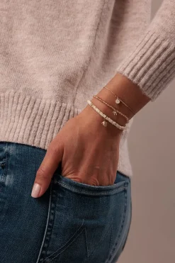 Gold & Enamel Tiny Chai on Beige Zircon