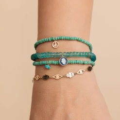 Pure Gold Peace Sign on Turquoise